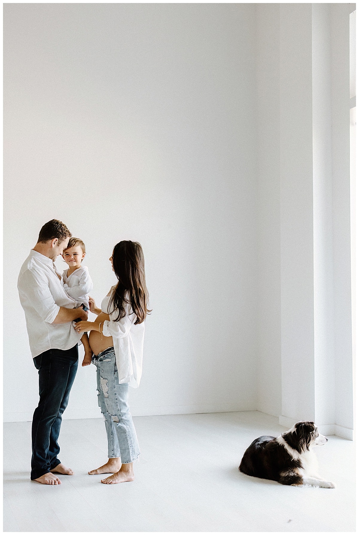 Mom and dad hug baby boy for Our Adventuring Souls Photography
