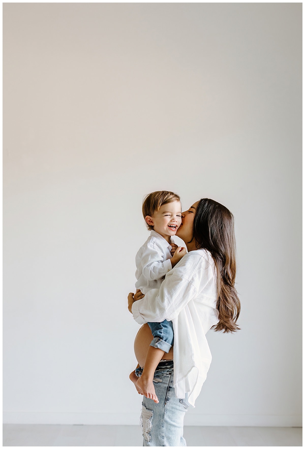Mom kisses baby boy for Our Adventuring Souls Photography