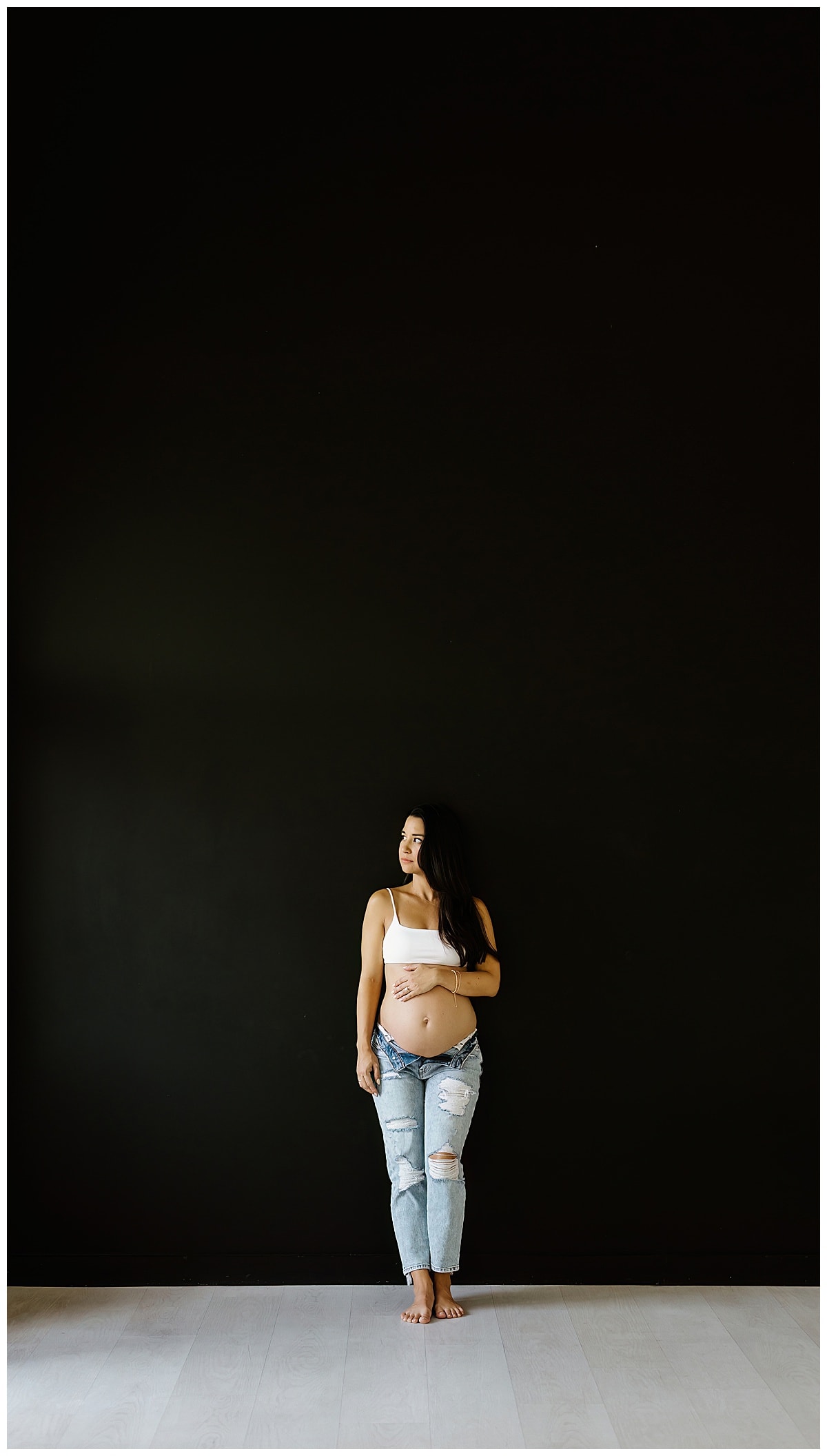 Mom stands tall holding pregnant belly for Our Adventuring Souls Photography