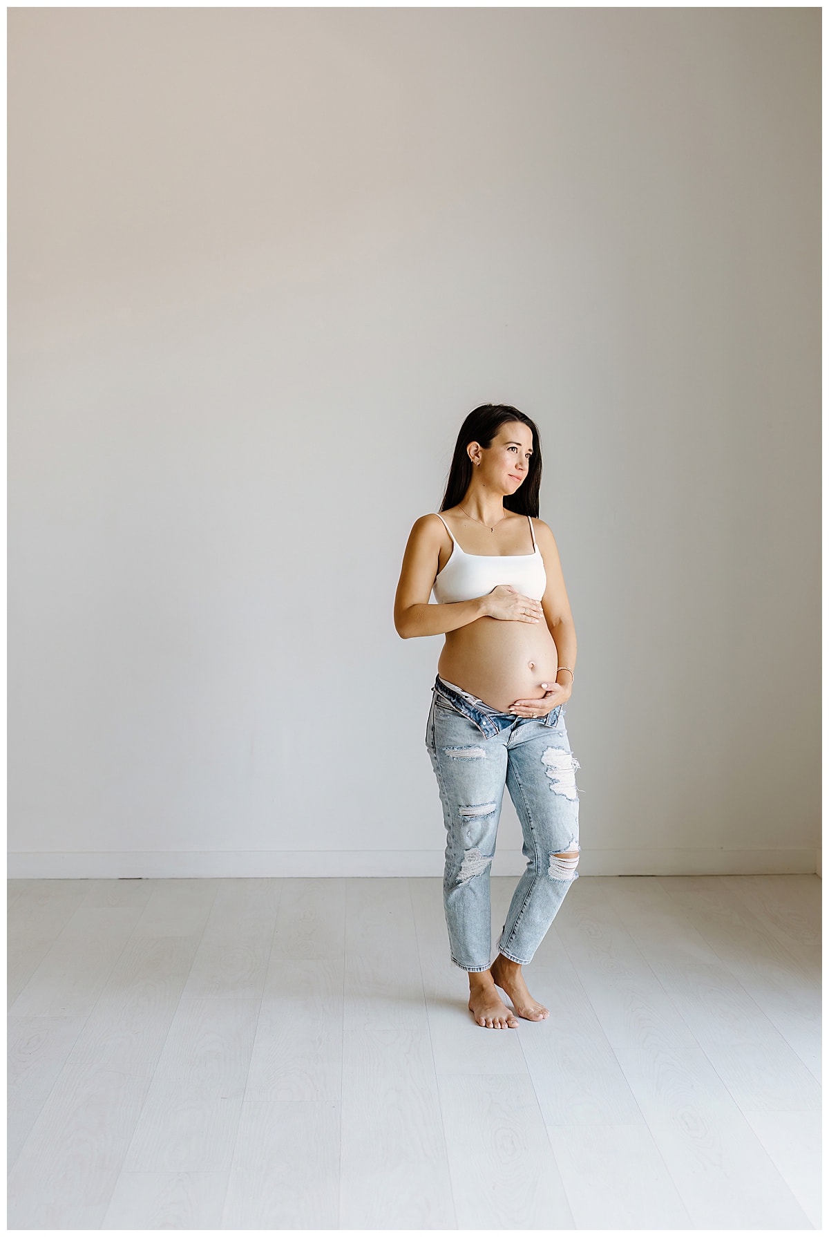 Mom stands tall holding pregnant belly for Our Adventuring Souls Photography