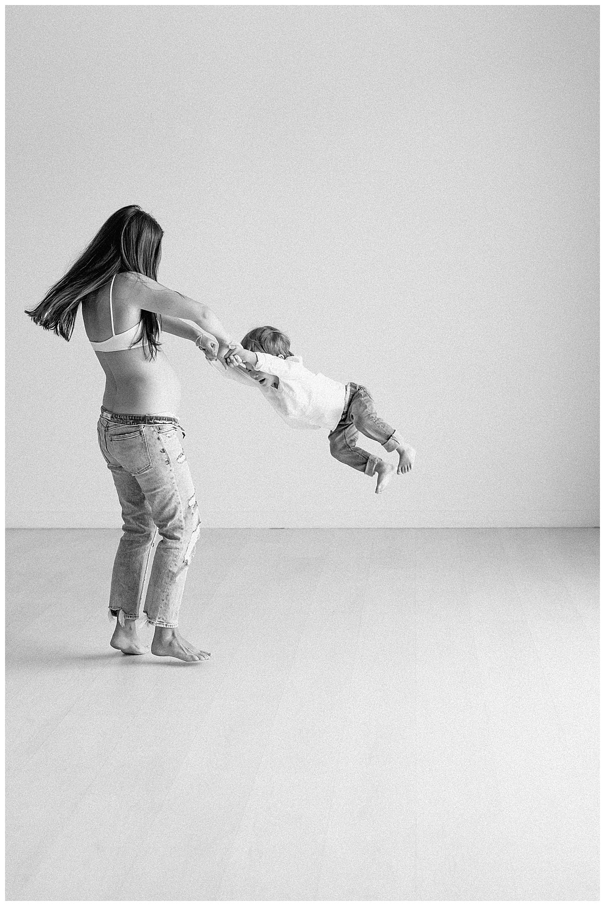 Mother and sone dance and spin together for Our Adventuring Souls Photography