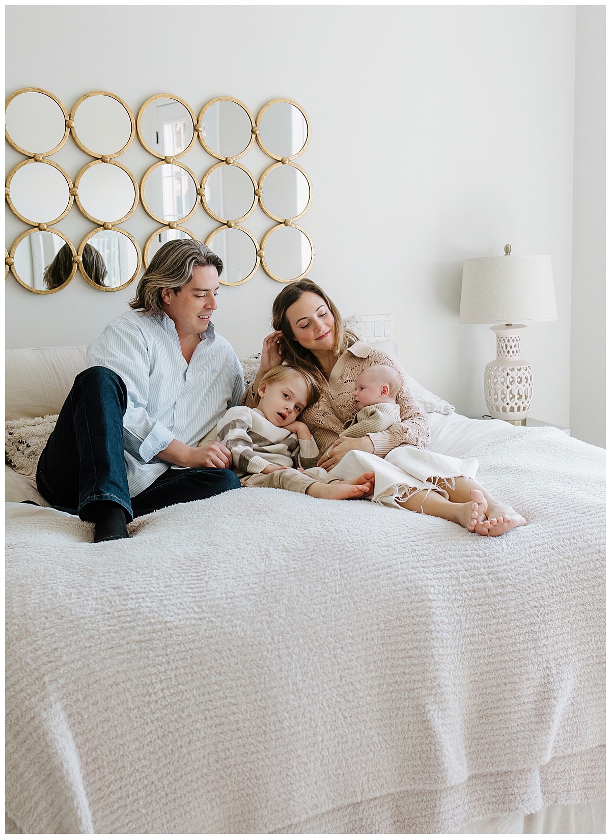 Parents smile with their babies for a successful Newborn Session With Siblings