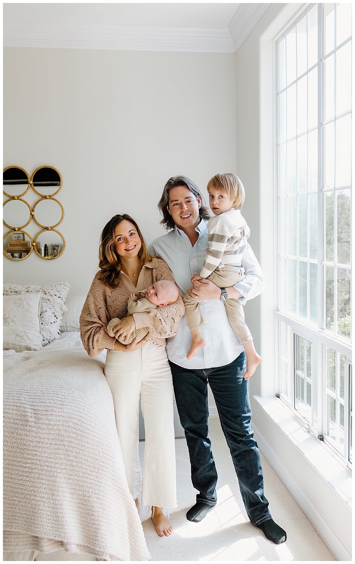 Mom and dad holds kids close for a successful Newborn Session With Siblings