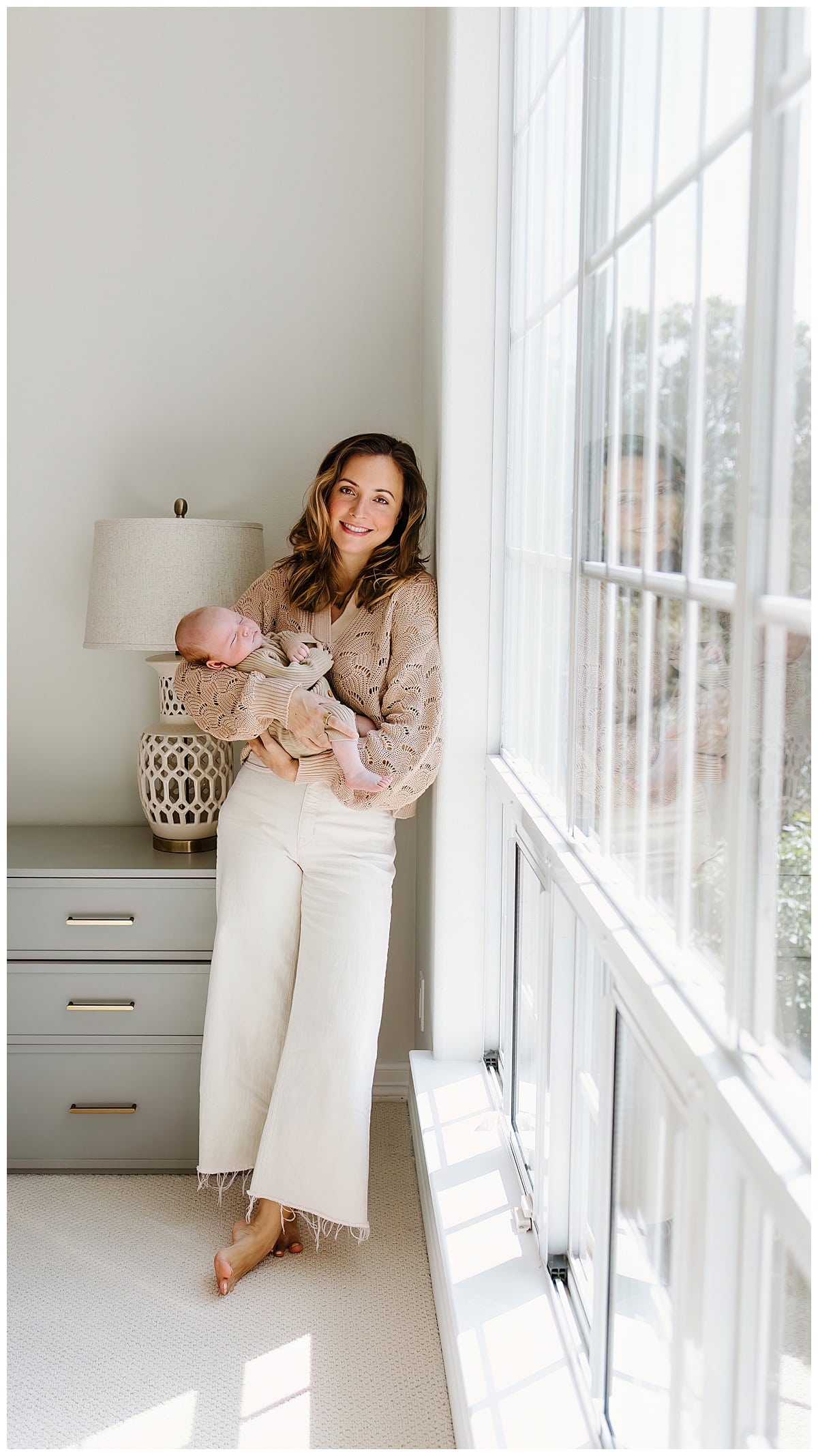 Mom holds baby for successful Newborn Session With Siblings