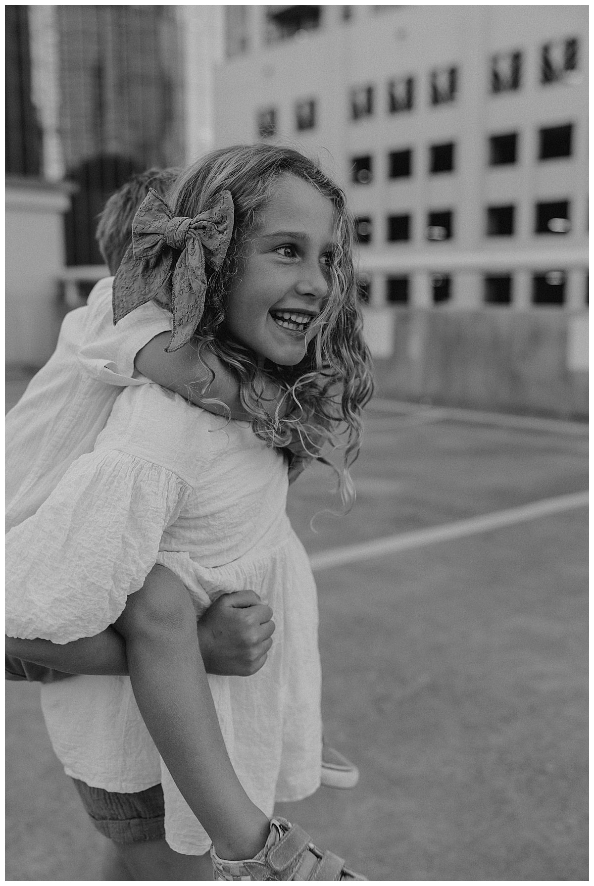 Siblings hold one another close for Austin Lifestyle Photographer