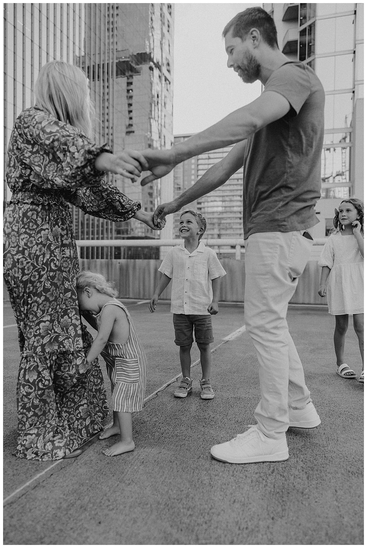 Family plays together for Downtown Austin Rooftop Family Session 