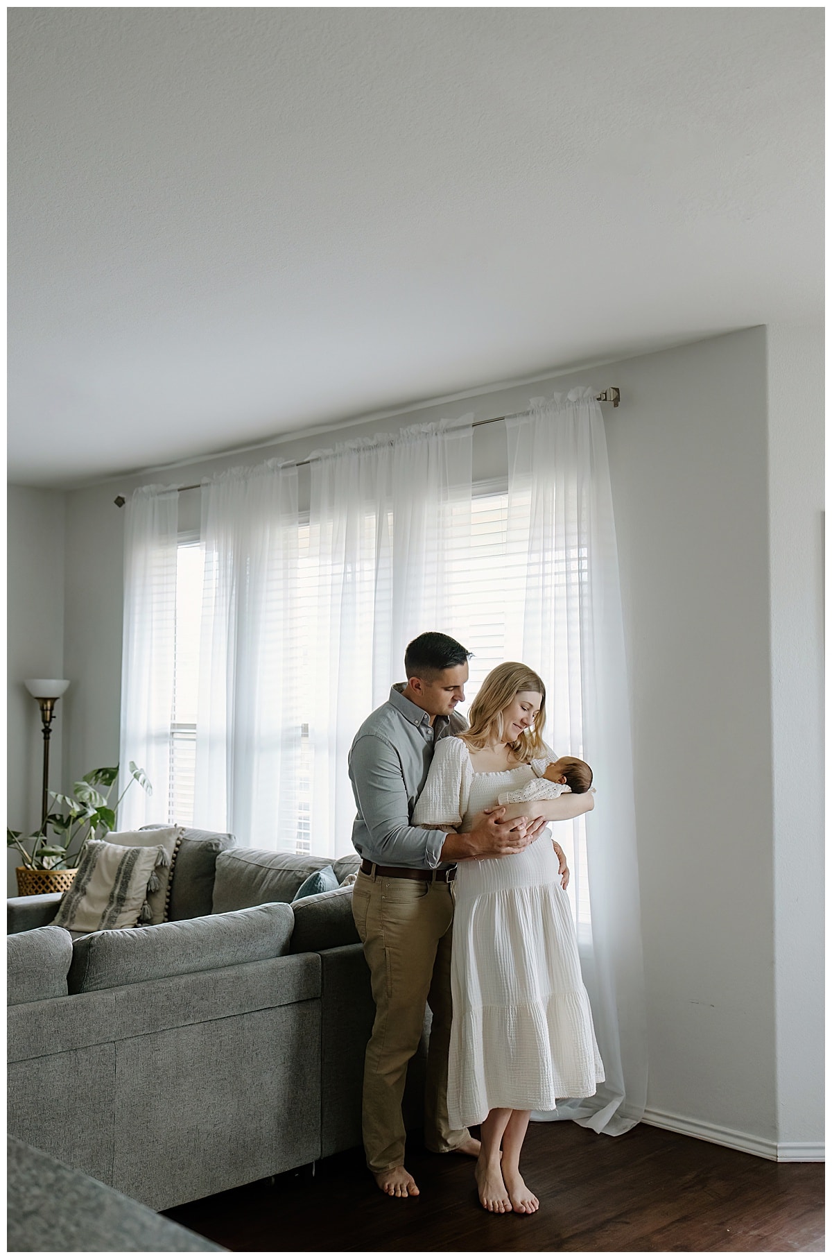 Mother and father smile at baby for Our Adventuring Souls Photography