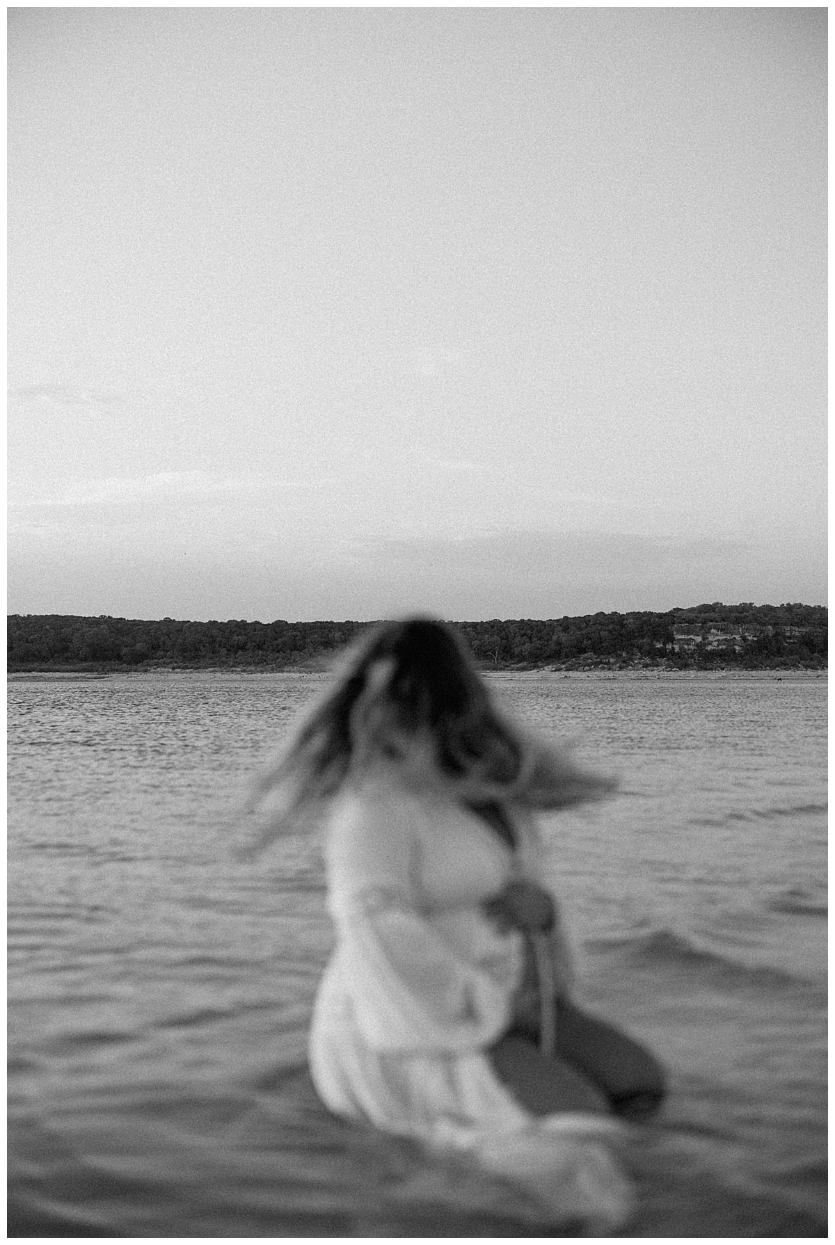 Mom sits in the water for Austin Motherhood Photographer