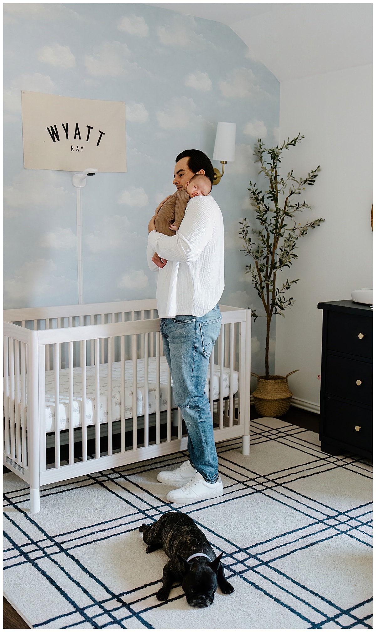 Dad holds baby close for Austin Newborn Photographer