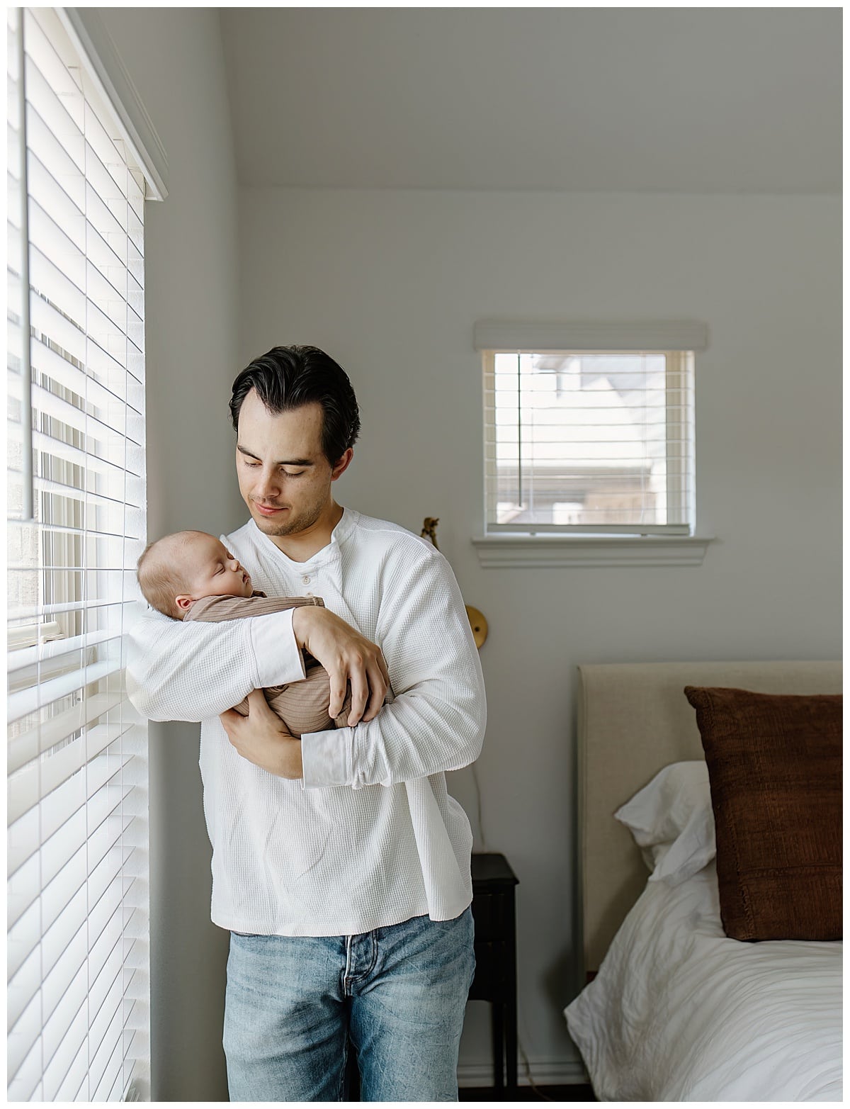 Dad stares down at baby for Our Adventuring Souls Photography
