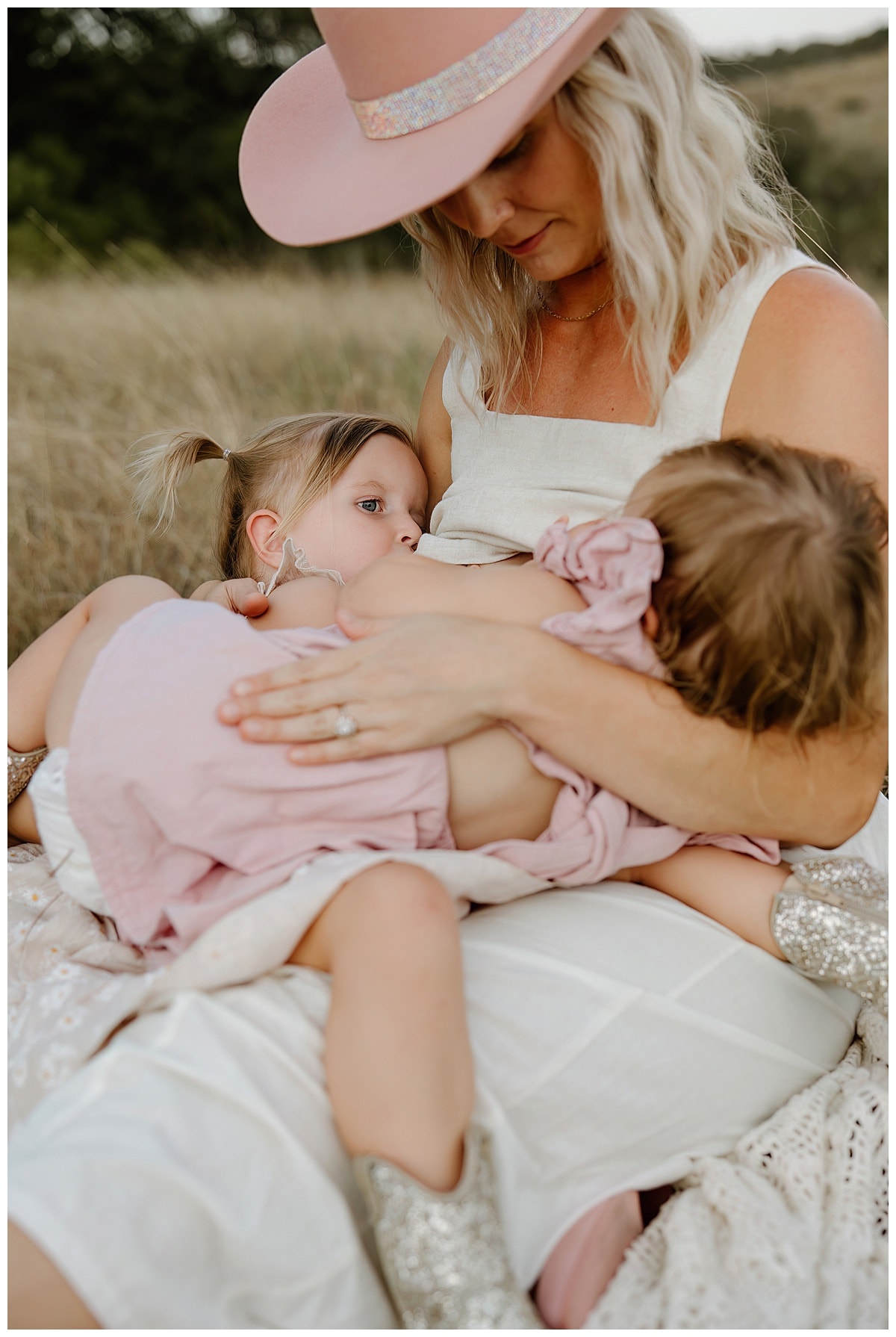 Mom sits with daughters during her Outdoor Motherhood Story 