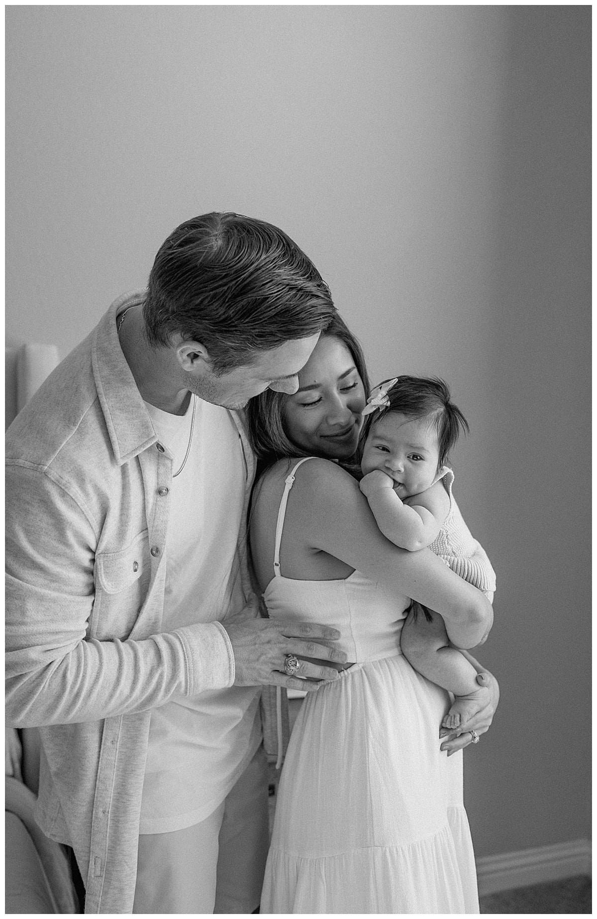 Mom and dad hold baby tightly understanding the importance of being able to Document Your Newborn