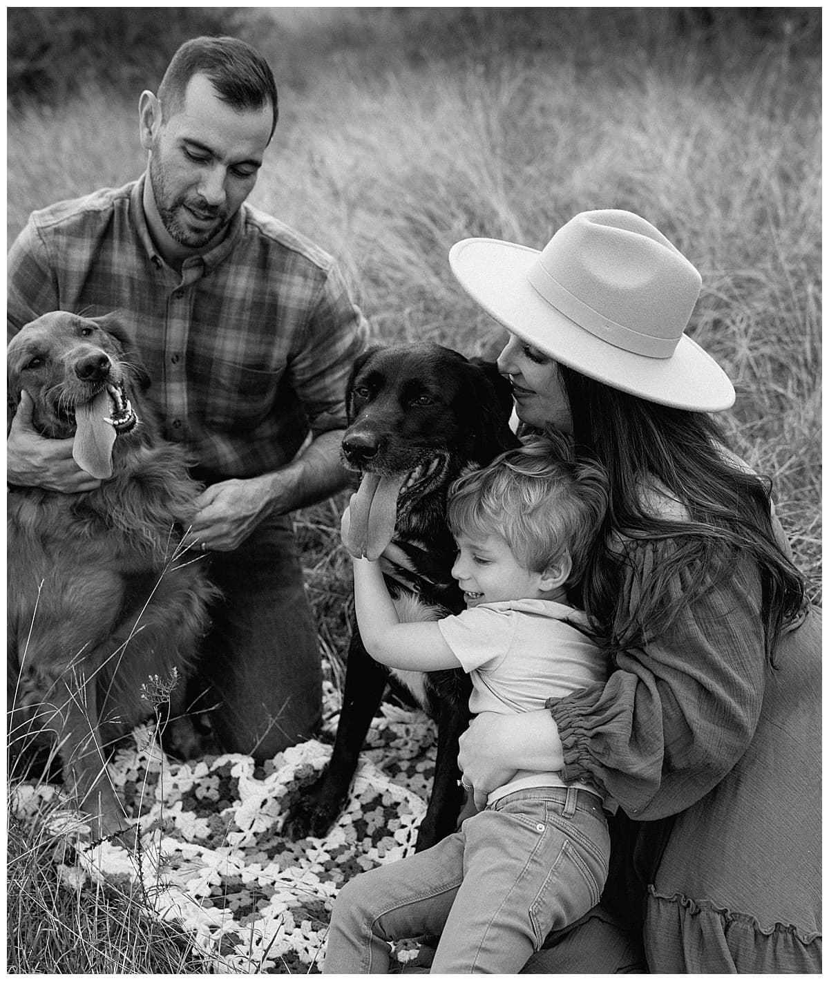 Family cuddle together holding their baby announcement for Austin Motherhood Photographer