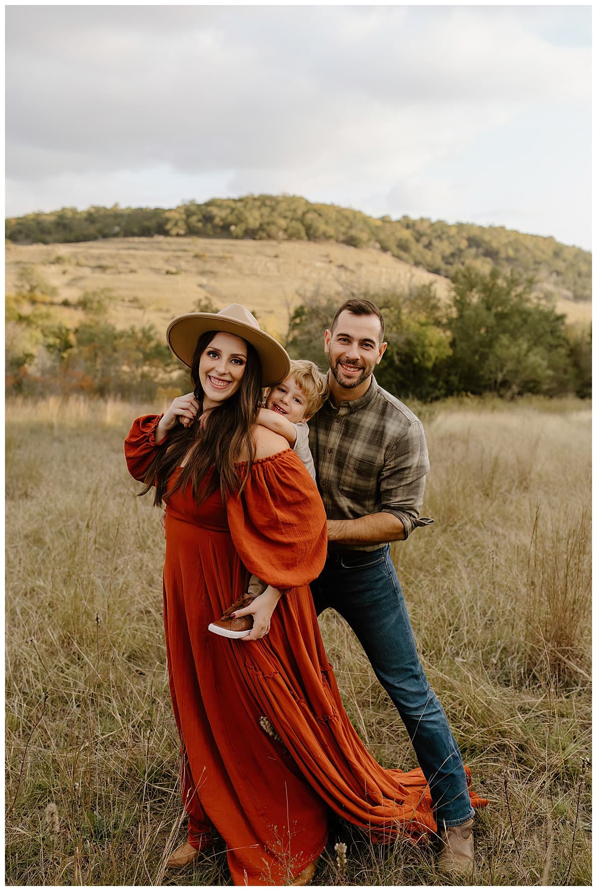 Parents play with their young son after their Baby Announcement