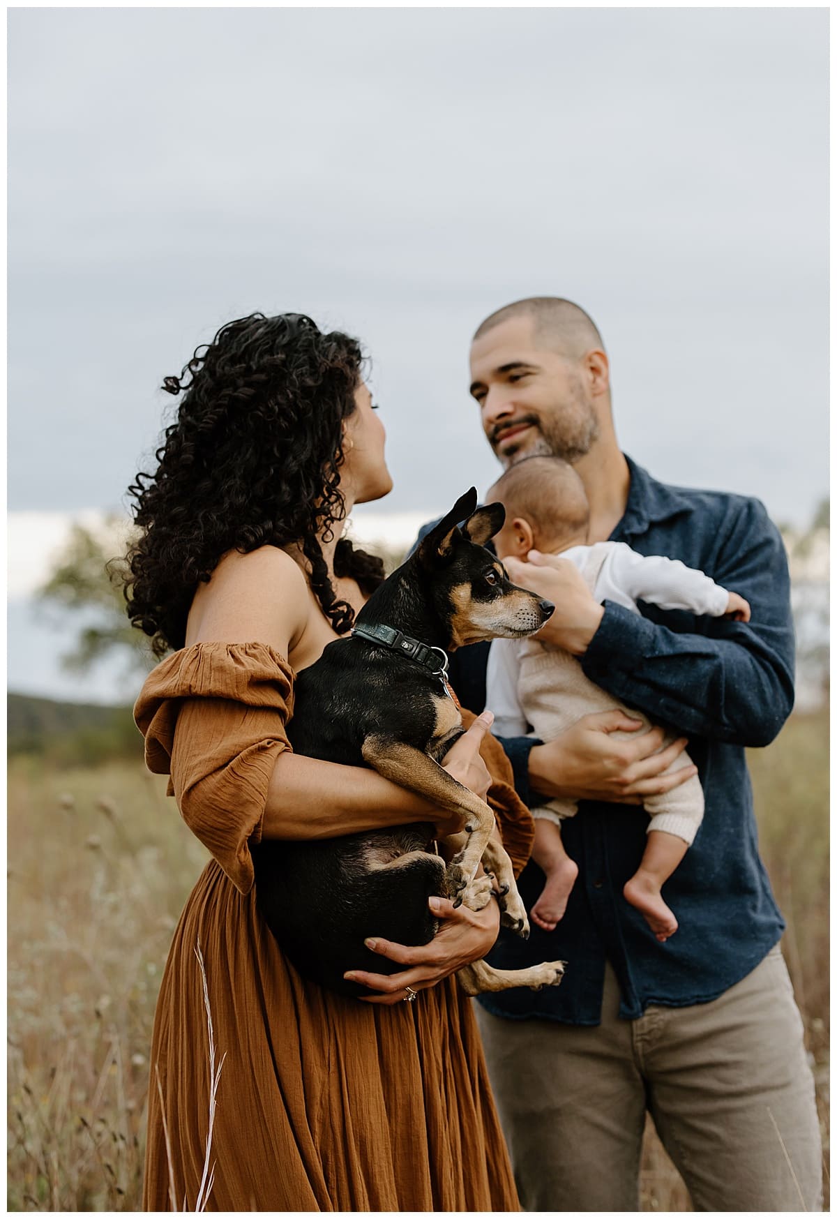 Parents smile at each other during their Lifestyle Family Photos 
