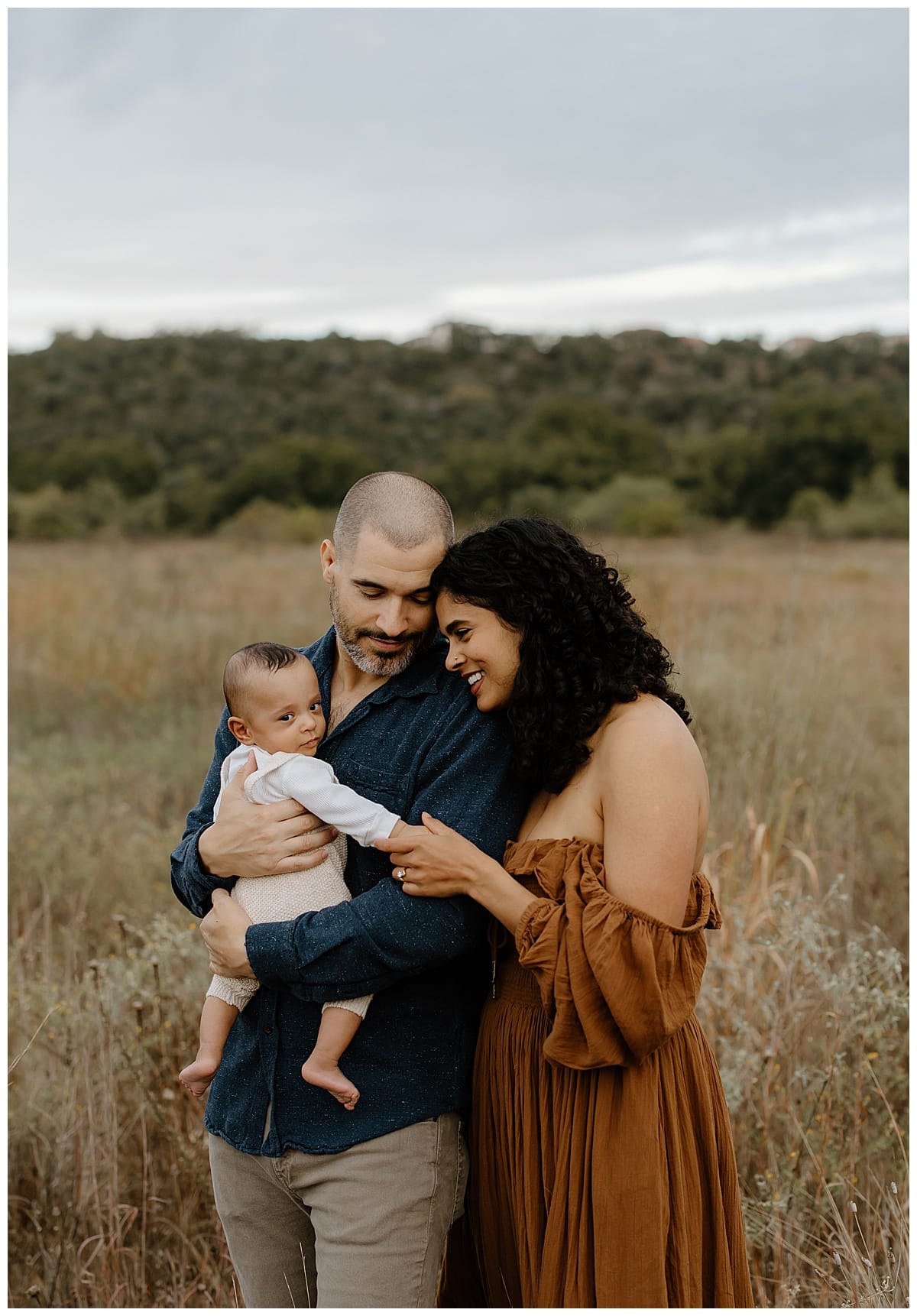 Parents smile at their son for Our Adventuring Souls Photography