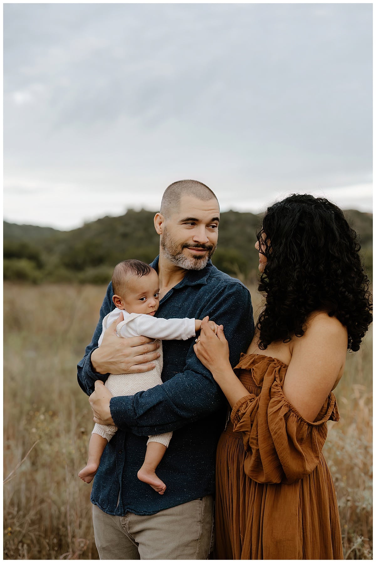 Dad smiles at mom for Austin Lifestyle Photographer