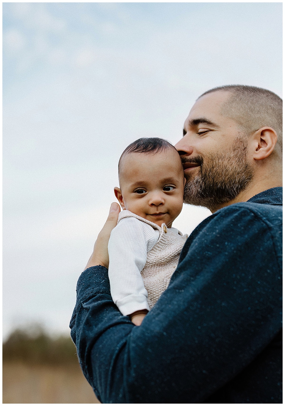 Dad shares a kiss with son for Our Adventuring Souls Photography