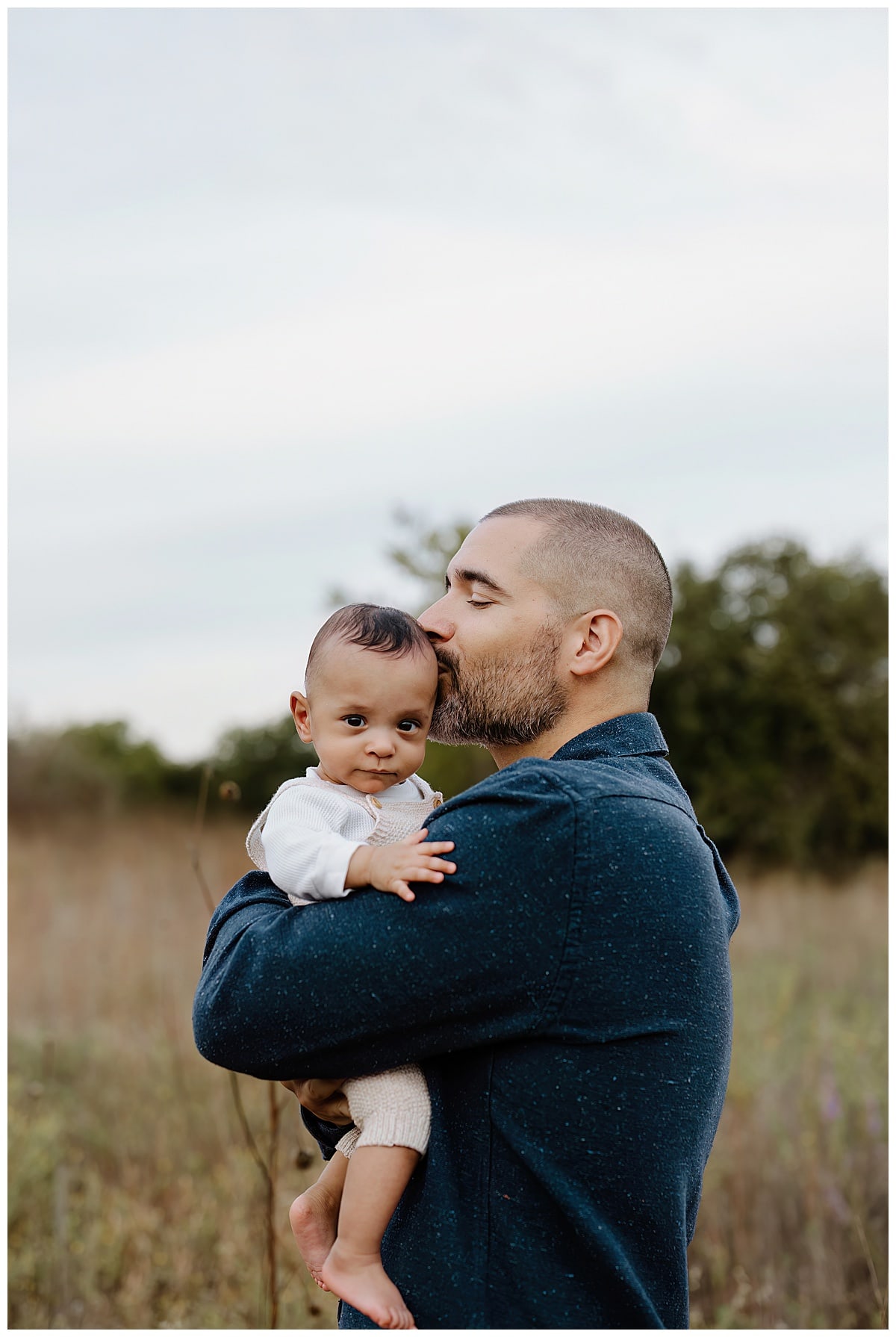 Dad and son share a kiss for Lifestyle Family Photos 