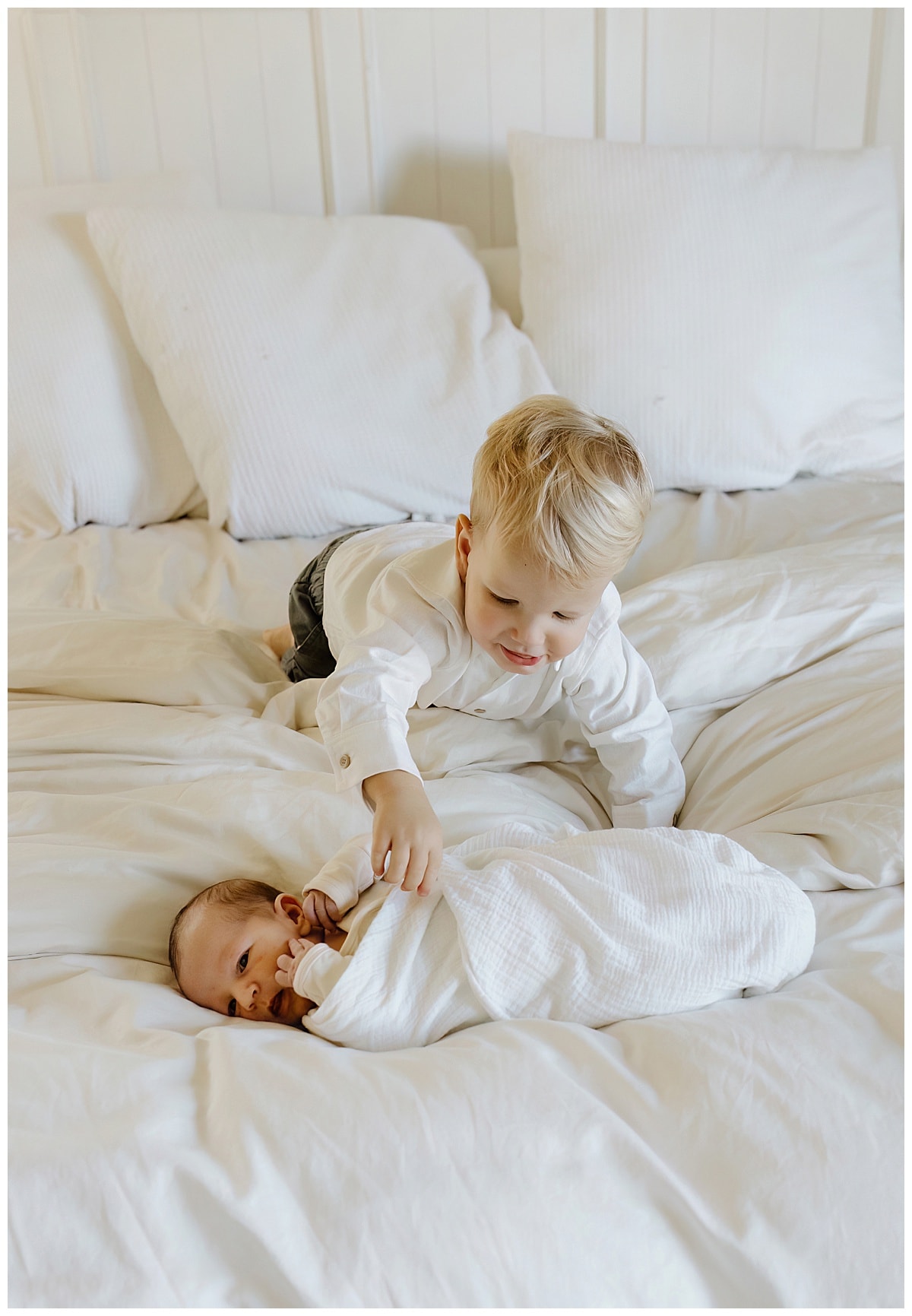 Older brother plays with baby brother for Our Adventuring Souls Photography