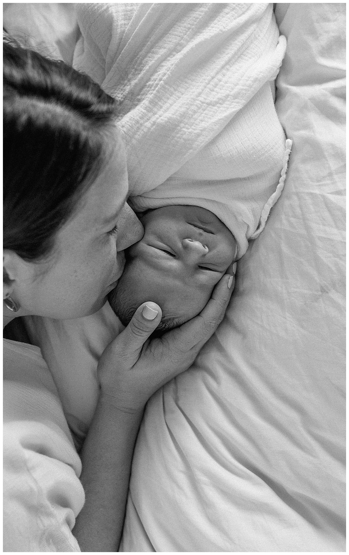 Mom lays close to baby to Create Memories during their Newborn Storytelling Session
