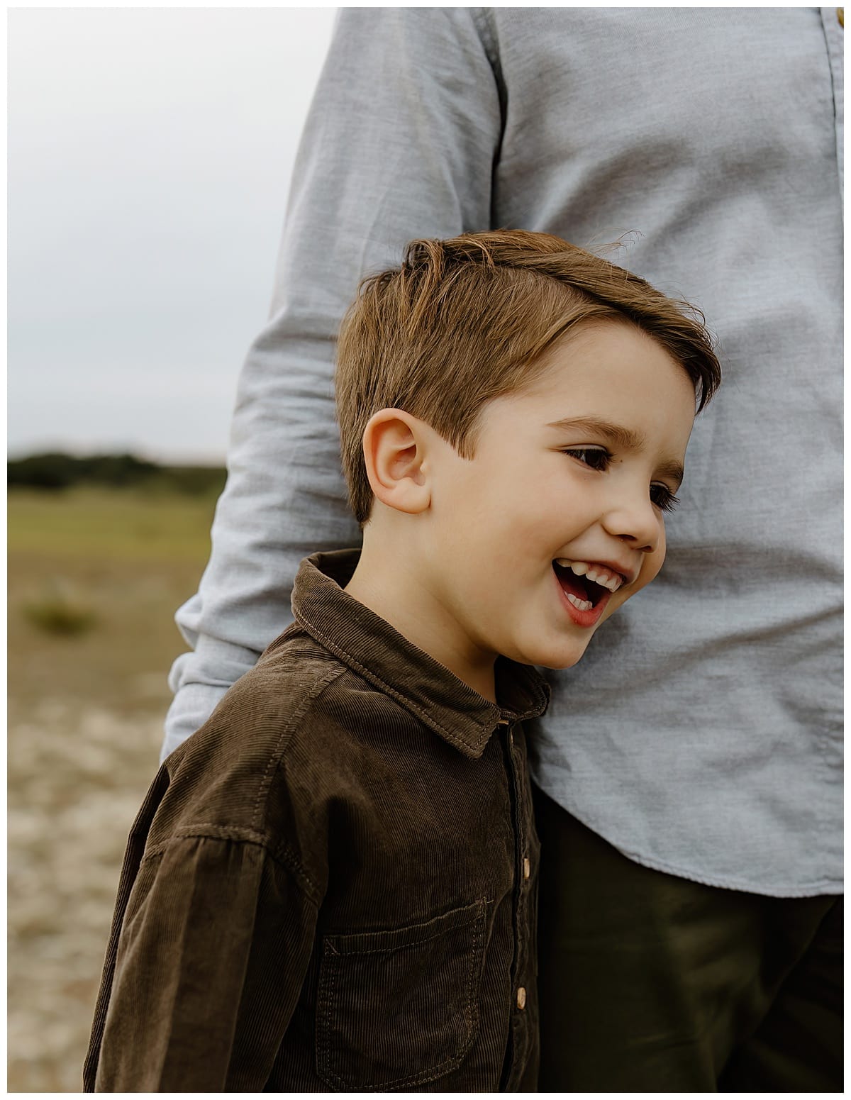 Young boy smiles big for Our Adventuring Souls Photography