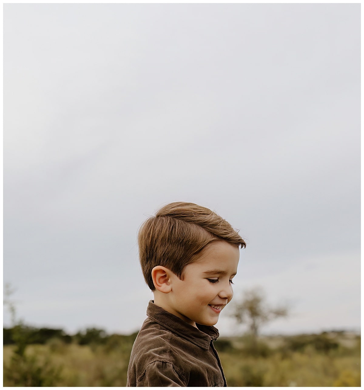 Young boy smiles during their Family Adventure Session