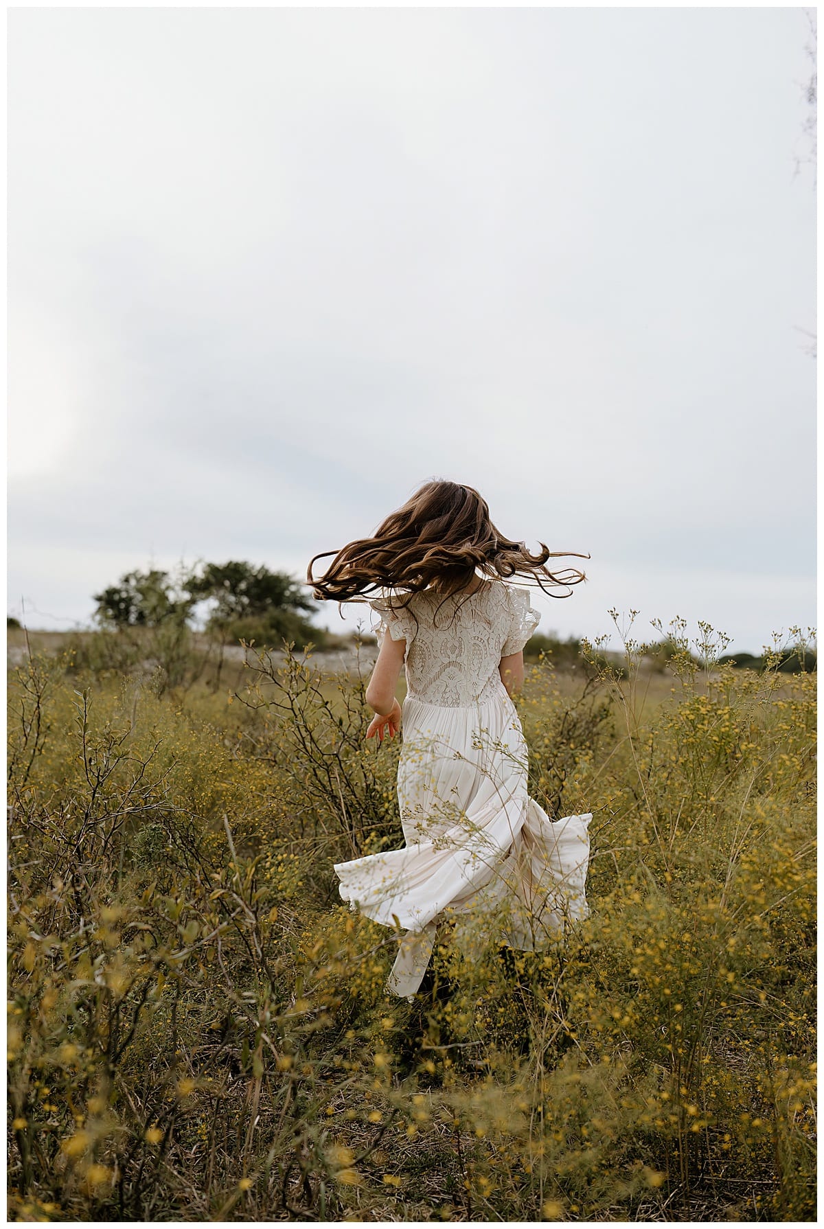 Girl twirls in her dress during their Family Adventure Session