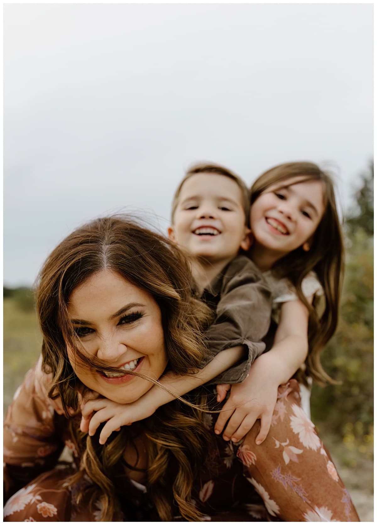 Kinds rid piggy back on mom for Austin Lifestyle Photographer