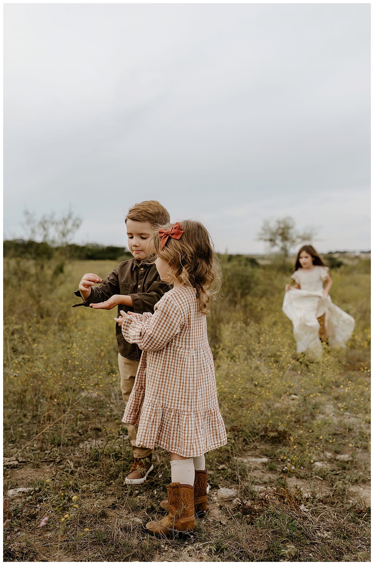 Young kids look at tree together for Our Adventuring Souls Photography