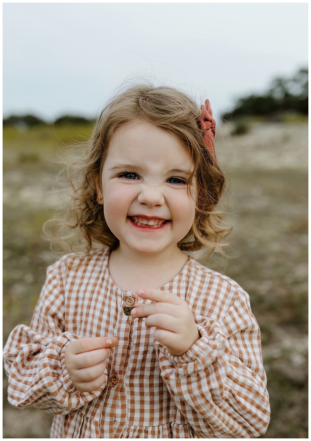 Little girls smiles big during their Family Adventure Session