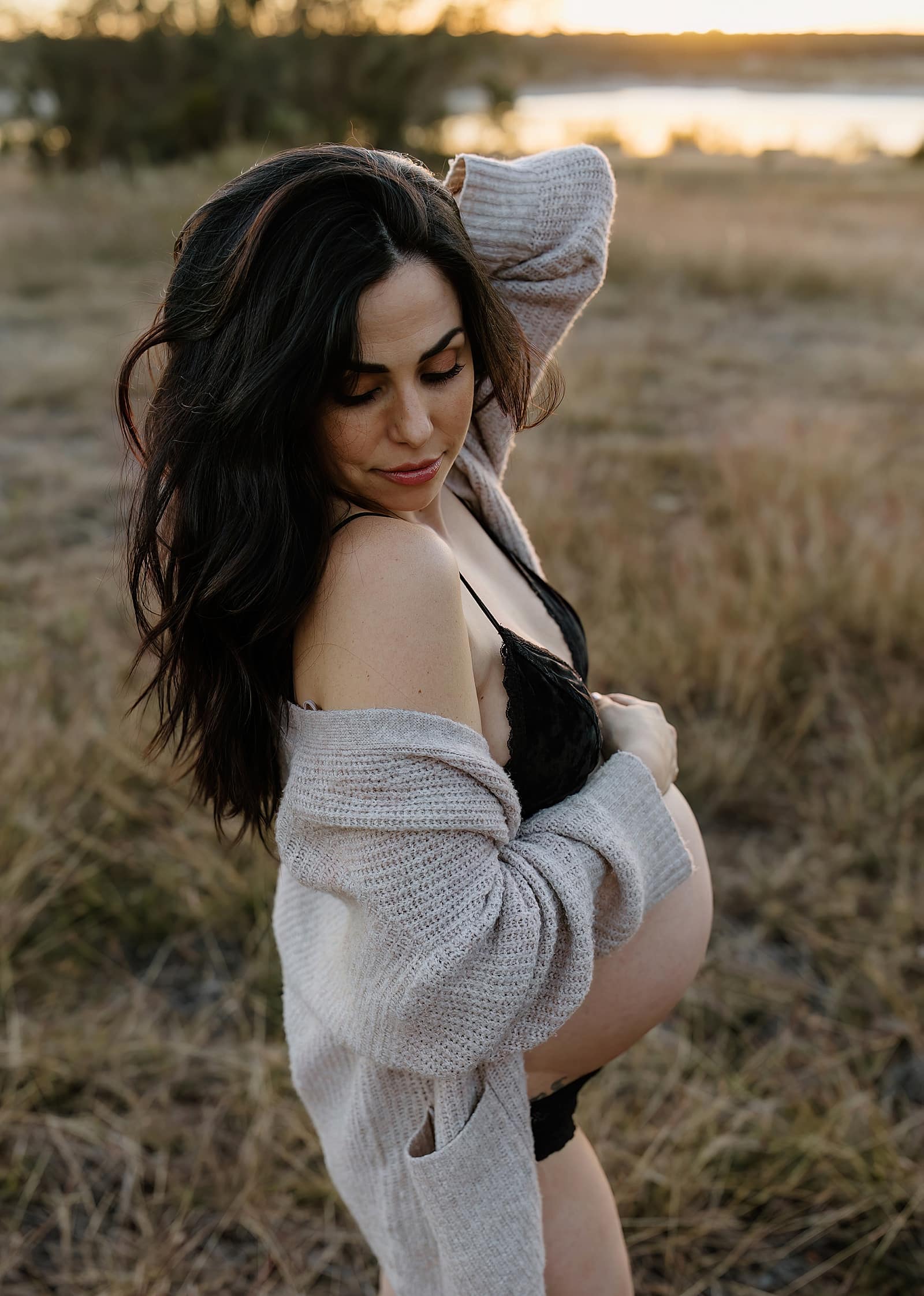 Mom holds pregnant belly for Austin Motherhood Photographer