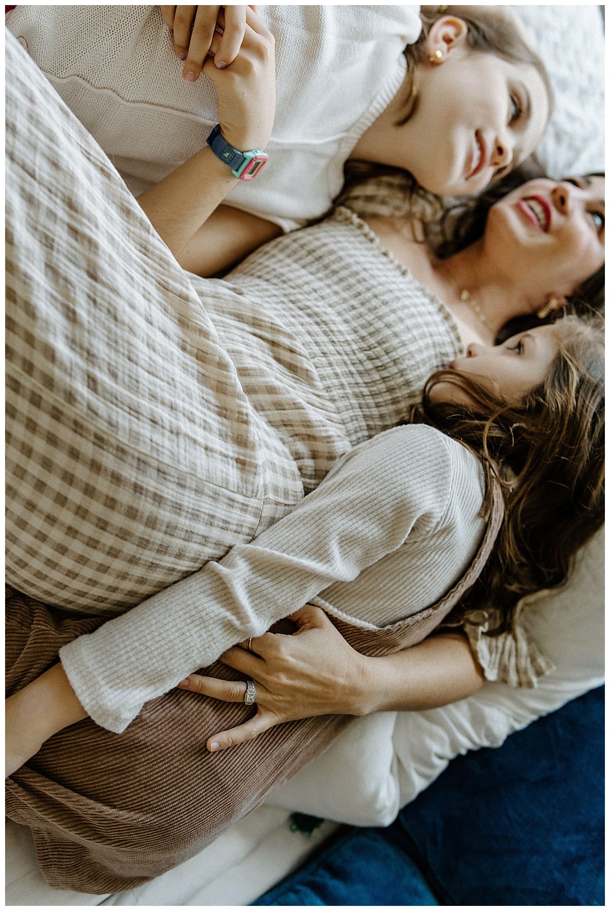 Mom holds little ones close during In-Home Documentary Family Photos