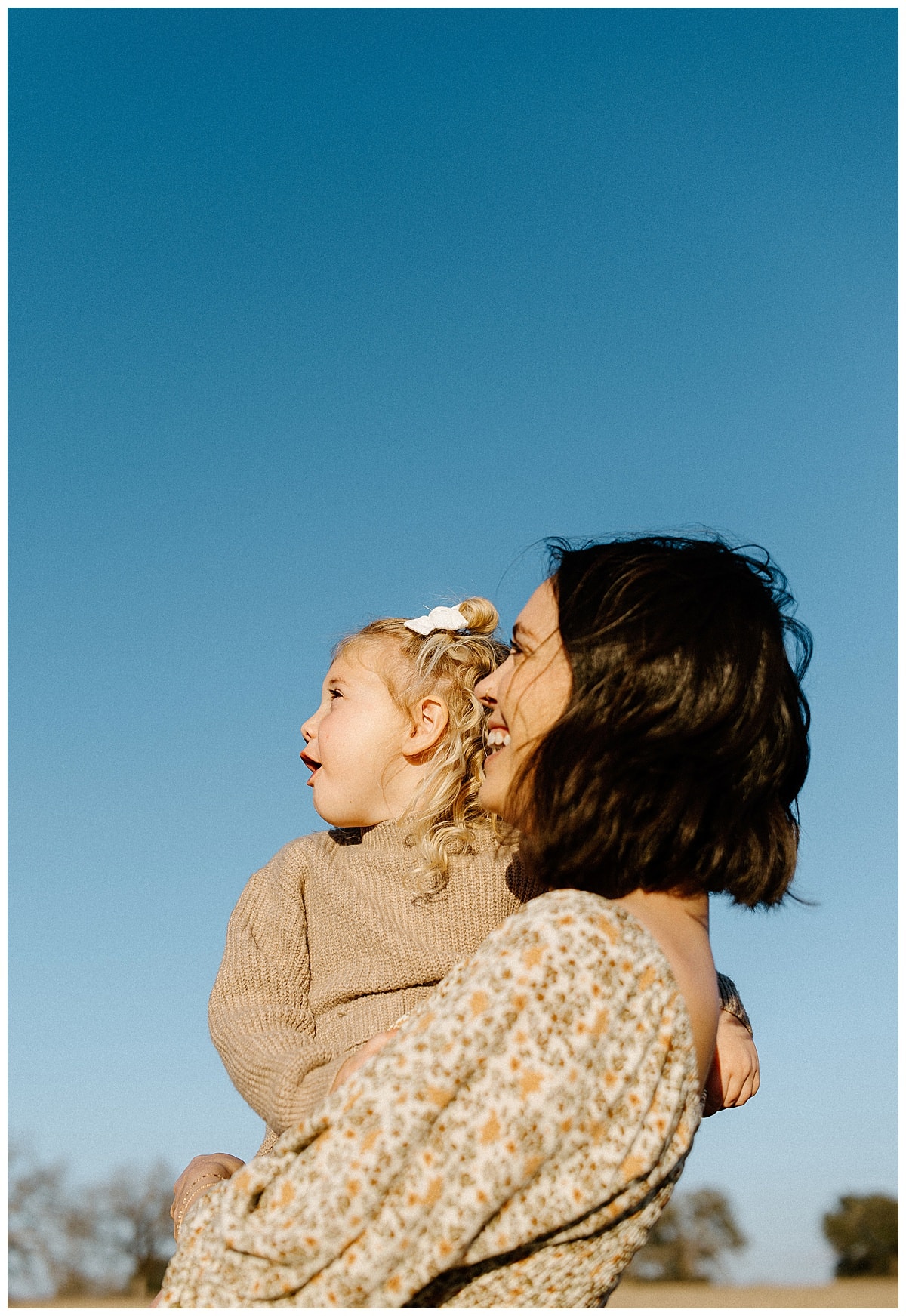 Mom and child look up at the sky for Our Adventuring Souls Photography