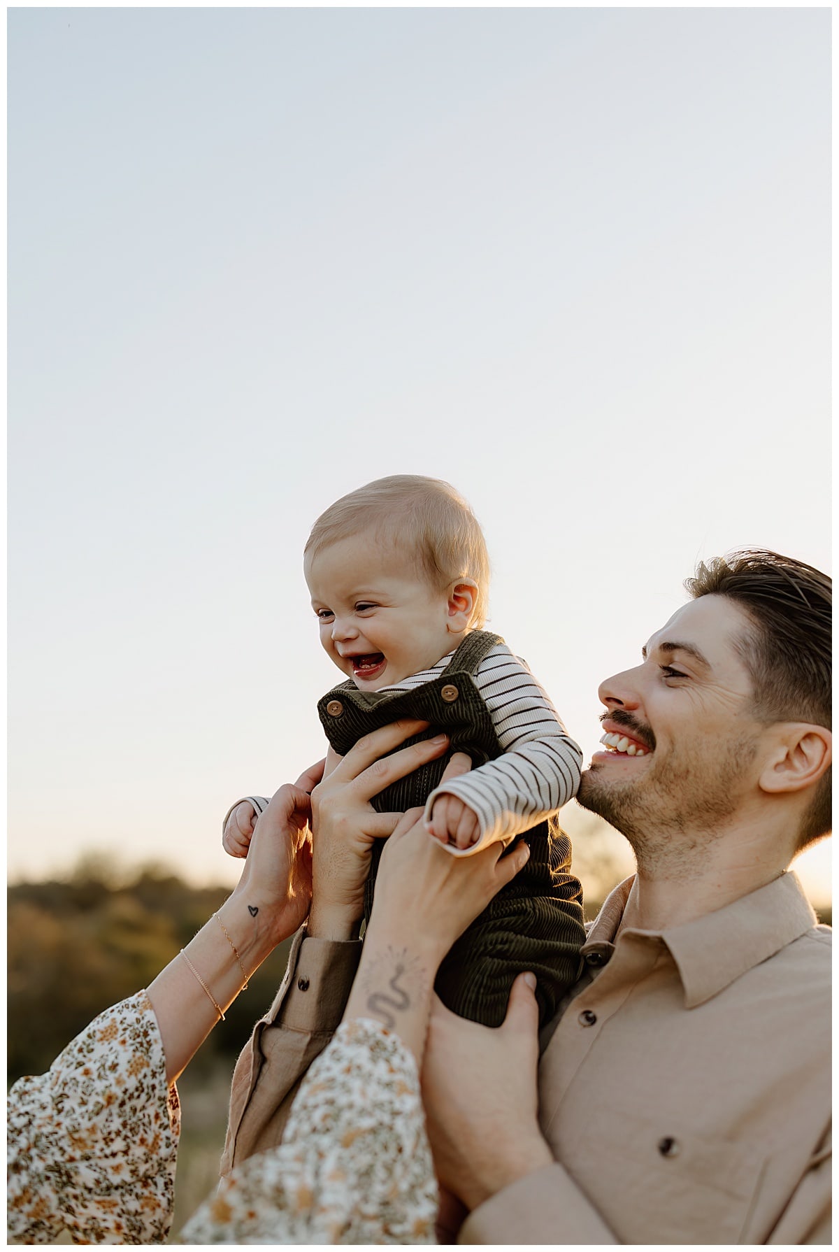 Dad holds child for Our Adventuring Souls Photography