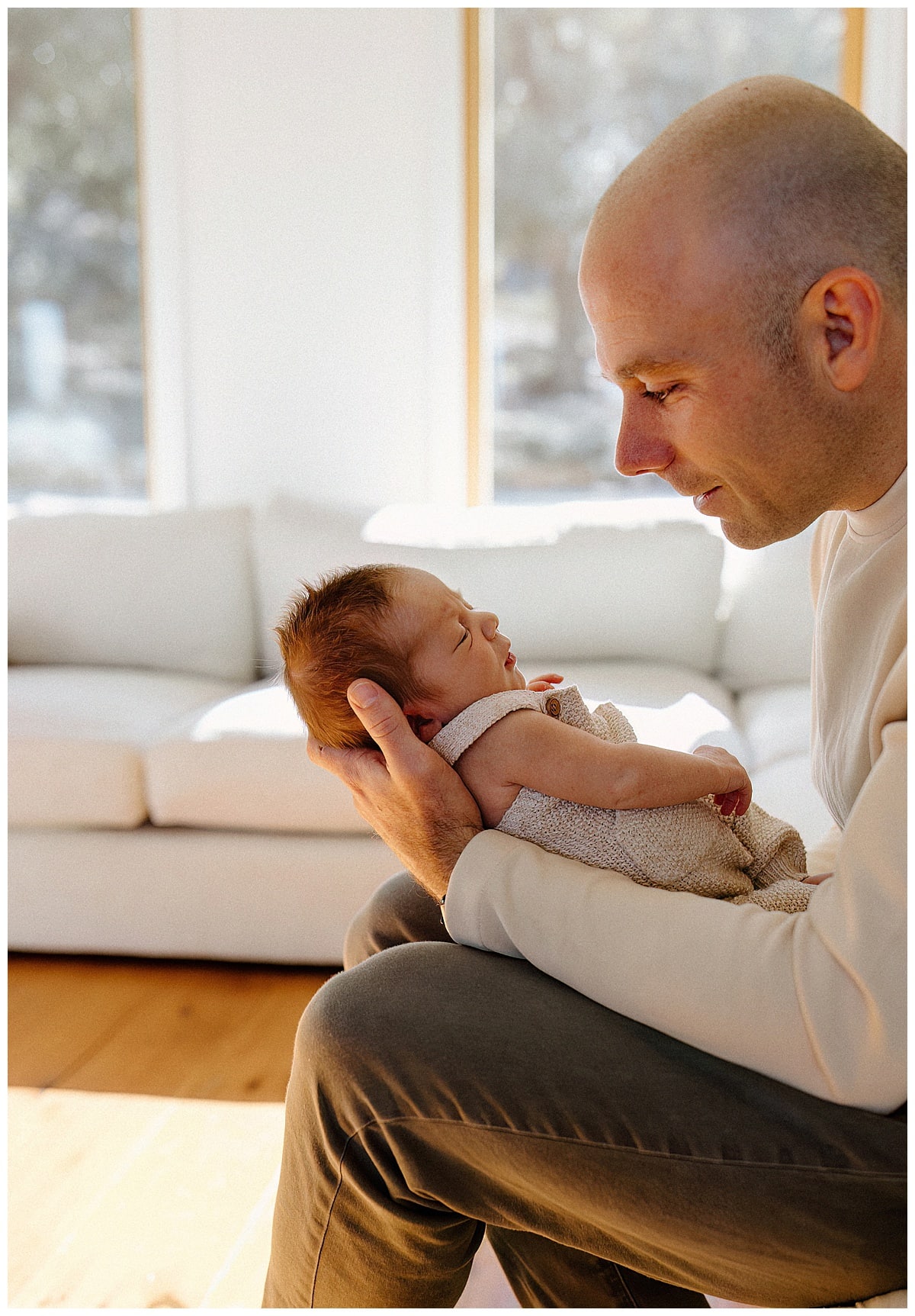 Dad stares and smiles at the baby for Austin Motherhood Photographer