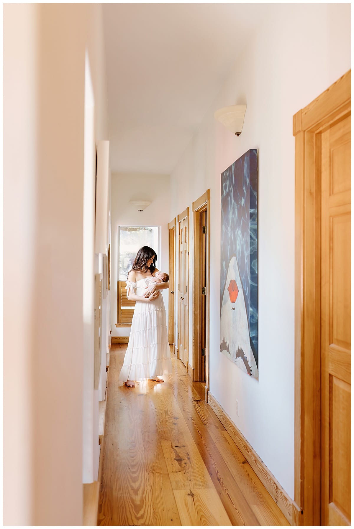 Mom walks with baby in the hallways for Our Adventuring Souls Photography