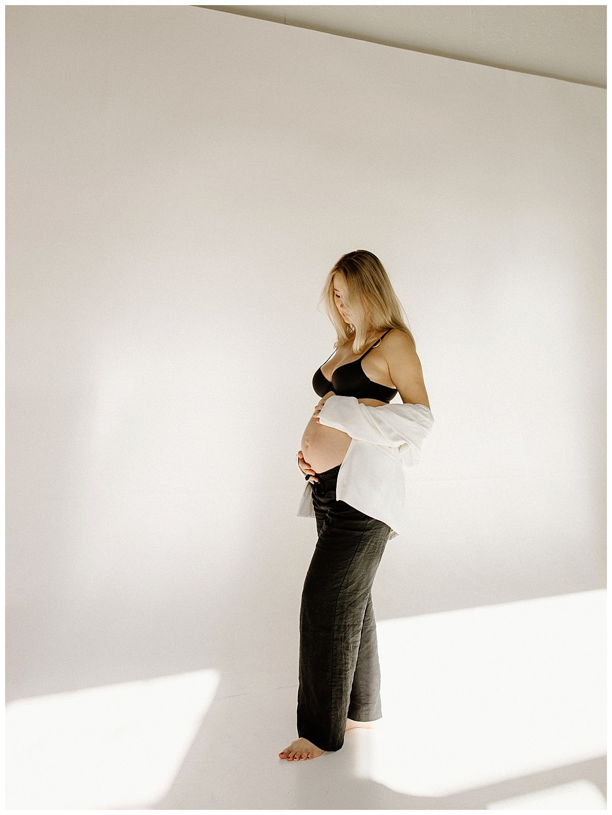 Mom embraces her pregnant belly for Austin Motherhood Photographer