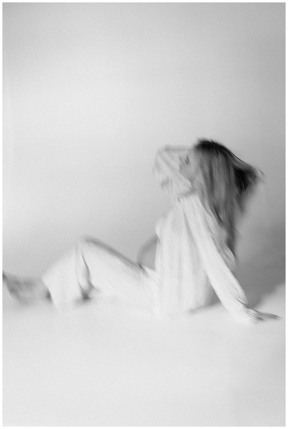 Woman sits on the floor for Austin Motherhood Photographer